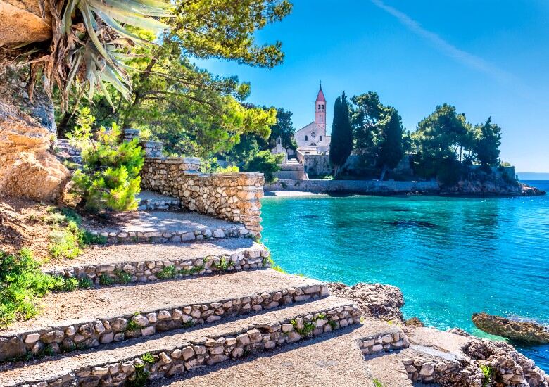View of Bol Dominican Monastery with turquoise water